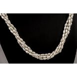 A freshwater rice pearl necklace with 9ct gold clasp, consisting of 4 strands of pearls, each
