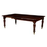 An early Victorian mahogany pull out extending dining table, with three additional leaves, the