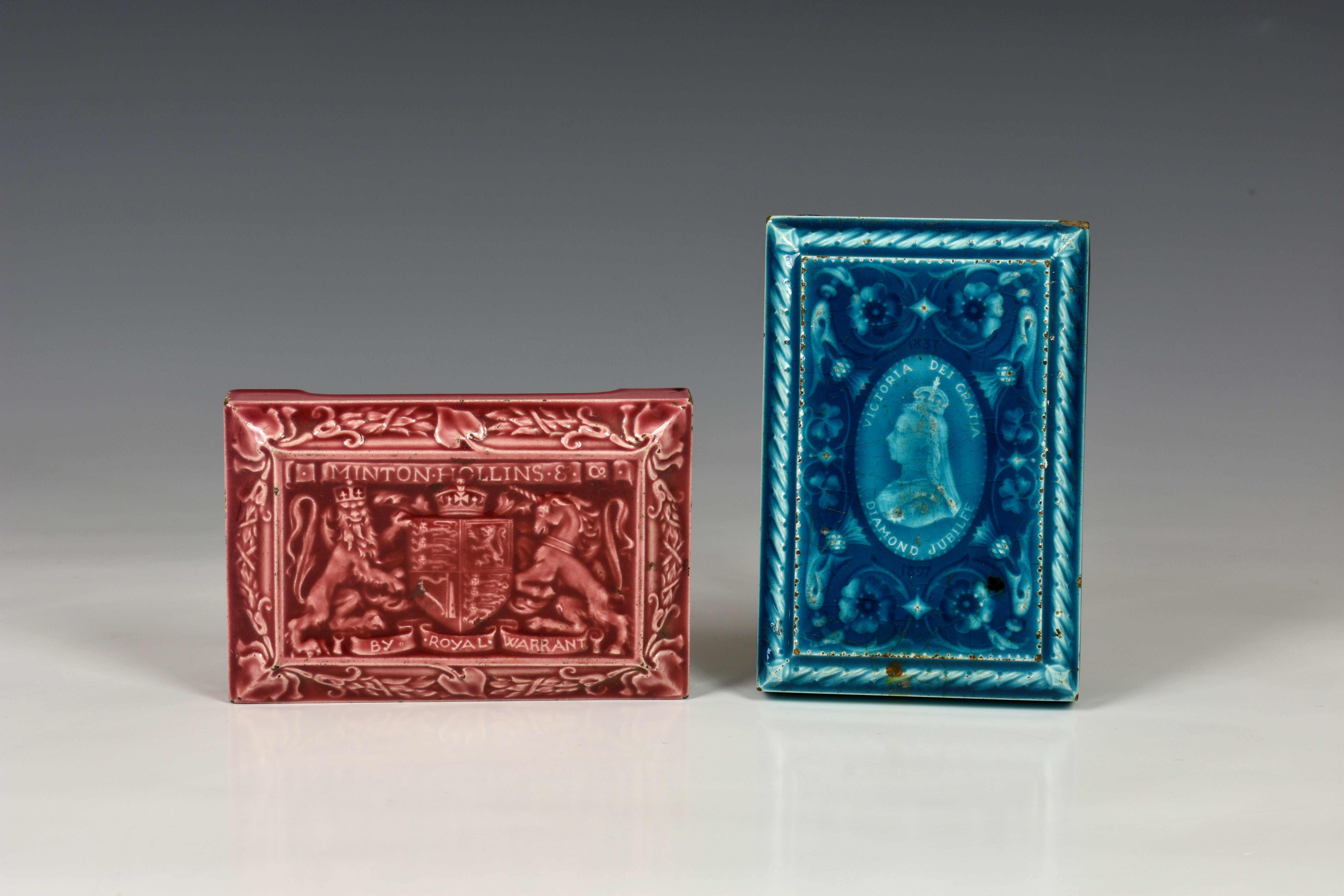 Two 19th century Minton Hollins & Co pottery tile paperweights, both of rectangular form with