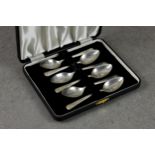 A cased set of six coffee spoons, Josiah Williams & Co., London 1944, inscribed 'D' to terminals,