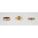 A trio of vintage 9ct gold rings, a plain wedding band (with engraving to the inside), a signet ring