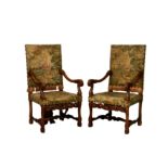 A pair of Victorian carved oak open armchairs in the 17th century style, the upright, rectangular