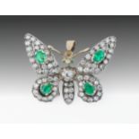 A good antique yellow gold, platinum, emerald and diamond butterfly pendant brooch, 1920s, set