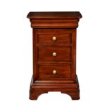 An antique style three drawer mahogany bedside chest, late 20th century, the three graduated drawers