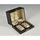 A cased pair of George VI silver toast racks, Barker Brothers Silver Ltd, Birmingham, 1938, the