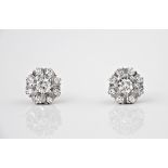 A pair of 18ct white gold and diamond cluster earrings, the brilliant cut diamonds totalling