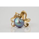 An Art Nouveau style 18ct gold, baroque black pearl and seed pearl ring, the single baroque black