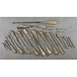 An extensive collection of mainly Victorian silver handled button hooks, of varying sizes, dates and