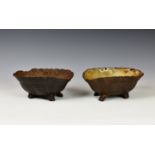 Two novelty Victorian cast iron dog bowls fashioned as inverted tortoises, the larger with