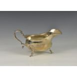 A George VI silver sauce boat, William Aitken, Birmingham, 1938, of typical form with wavy edge