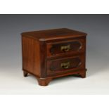 Early 20th century miniature mahogany chest of drawers, the rectangular moulded top with front