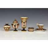 A collection of Imari pattern Royal Crown Derby, comprising a vase and cover, two further vases, a