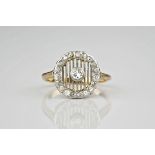 An Art Deco period 18ct yellow gold and diamond cluster ring, the central brilliant cut diamond