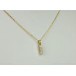 An 18ct yellow gold and diamond pendant, the pendant set with three graduated brilliant cut
