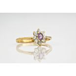 A 9ct yellow gold, amethyst and cubic zirconia cluster ring,