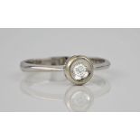 An 18ct white gold and diamond solitaire ring, the central brilliant cut diamond measuring