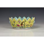 A Chinese famille rose oval bowl, probably late 19th / early 20th century, with a scalloped rim