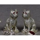 A pair of modern novelty salt and pepper pots fashioned as terrier dogs, each stamped 800, the