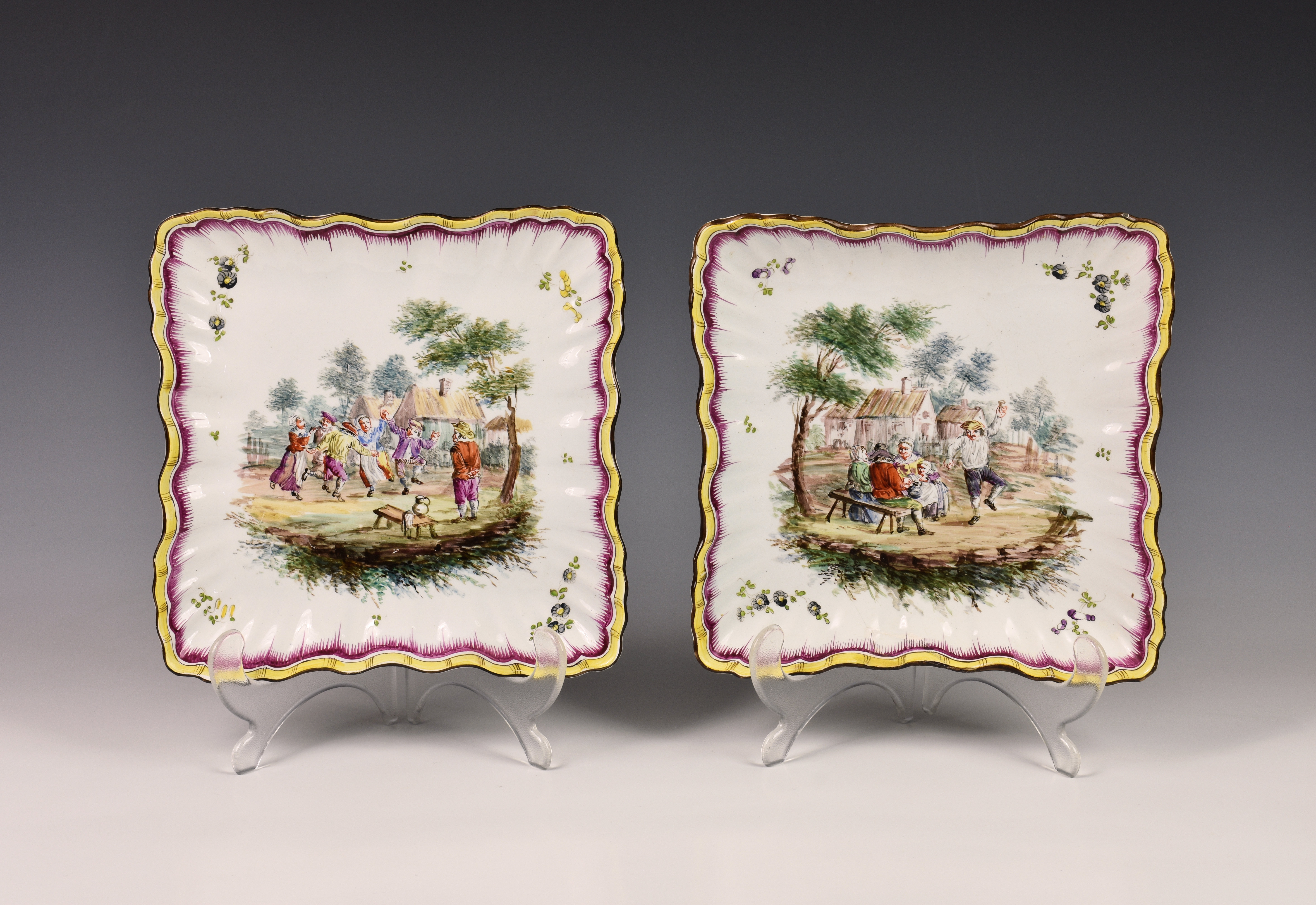 A pair of 19th century Continental porcelain plates, imitating enamel, of wavy edge and ribbed