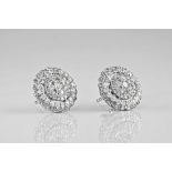 A pair of 18ct white gold and diamond target earrings, featuring 5 rows of bright, pavé diamonds.