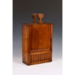 An unusual Georgian mahogany wall hanging wine bottle box, the vertical rectangular box with sliding