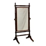 A late Regency mahogany cheval mirror, the original rectangular plate within a ring turned frame