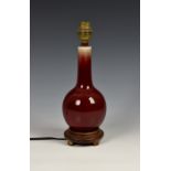 A Chinese flambe glazed bottle vase, later converted to a lamp, base drilled, probably 18th/19th