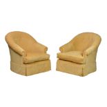 A pair of tub back armchairs, modern, the arched, buttoned backs over loose seat cushions,