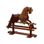 A 1997 limited edition sapele wood rocking horse made by Timber and Thread, swing stand style