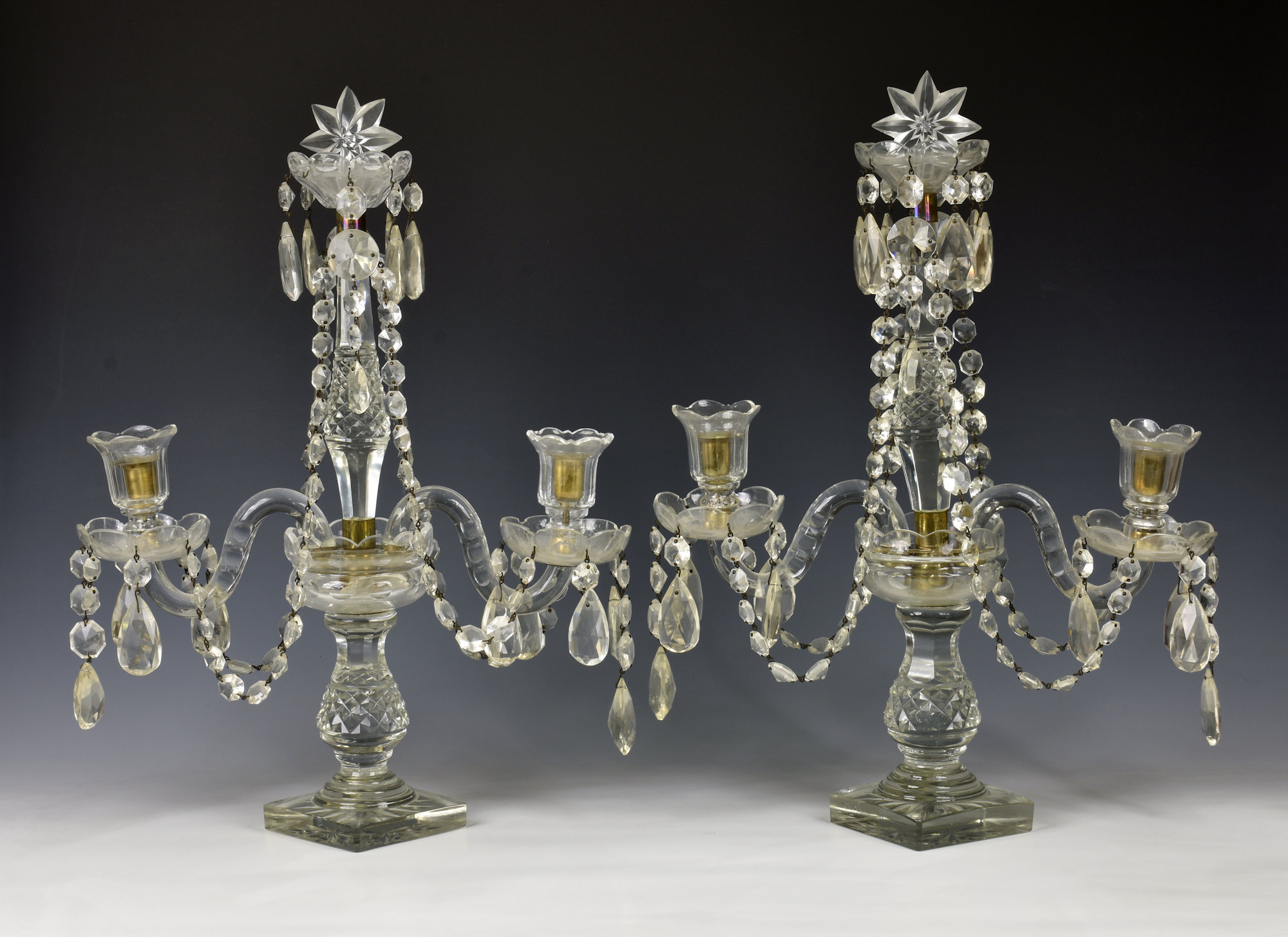 A pair of 19th century style cut glass two light candelabra, mid-20th century, the tall central