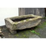 An antique Guernsey granite trough, of shallow rectangular form, approx. 43¼ x 27½in. (110 x 70cm.).
