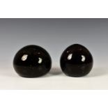 Two large Victorian dump weights, of globular form, one in dark amethyst, the other in dark brown,