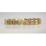 A 3 colour 9ct gold gated bracelet,