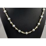 A yellow gold, pearl and seed pearl necklace, the silver toned, round pearls measuring approximately