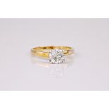 A diamond solitaire ring, the round cut diamond weighing approximately 1ct and set in a 9ct yellow