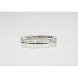 A platinum and diamond half eternity ring, featuring 11 brilliant cut diamonds in a channel