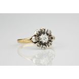 A mid-century 18ct yellow gold, platinum and diamond floral cluster ring, the central cushion cut