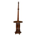 An oak table lamp standard, first half 20th century, the turned, foliate carved column over a