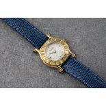 A lady's Gucci 6500L gold plated quartz wristwatch, with wave decorated silvered dial with quarter