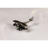 A modern miniature silver model of a biplane, stamped 925, 1 3/8in. (3.5cm.) long, weight 0.25 tr.