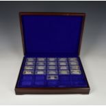 A part cased set of 21 of 30 silver 'Locomotive' ingots by Birmingham Mint, in capsules, approximate