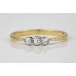 A 9ct yellow gold and diamond trilogy ring, total diamond weight approximately 0.11ct, ring size