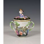 A 19th century Capodimonte chocolate cup and cover, of typical form decorated with figures bathing
