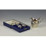 A cased set of Elizabeth II silver salt and pepper casters, Da-mar Silverware, London 1976, of