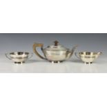 A Walker & Hall silver plated three piece tea service, early to mid 20th century, of circular