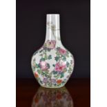 A Chinese porcelain famille rose bottle vase, 20th century, enamelled with peonies, magnolia and