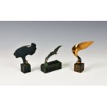 Three modern Spanish bronzes, the first depicting an eagle in flight, raised on chequered