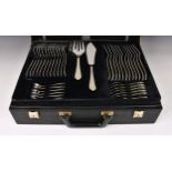 A leather cased canteen of silver plate cutlery by Solingen, with raised decoration, partially