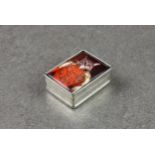 A modern miniature pill box with enamel lid depicting a pictorial image of a cat, stamped sterling