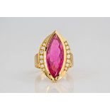 A marquise cut pink tourmaline and diamond 18ct yellow gold ring., A pink tourmaline in a diamond